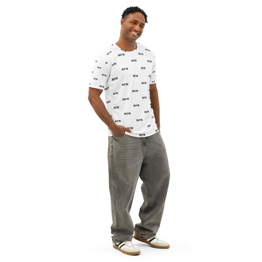 Man wearing a white t-shirt with black text and gray pants on a white background
