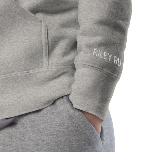 Gray sweatshirt with 'RILEY RU' logo on sleeve against a white background
