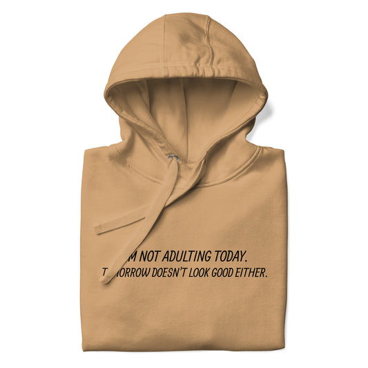 Tan hoodie with text 'I'M NOT ADULTING TODAY. TOMORROW DOESN'T LOOK GOOD EITHER.' on a white background