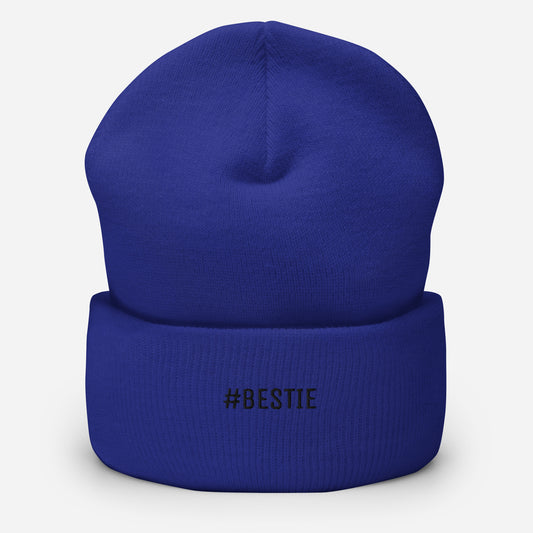 Blue beanie with '#BESTIE' text on a white background