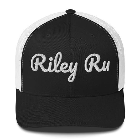 Black and white cap with 'Riley Ru' text on a white background