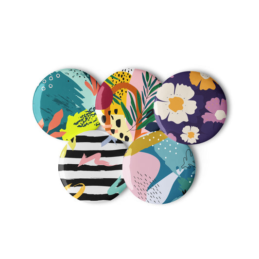 Set of five colorful coasters with various patterns on a white background