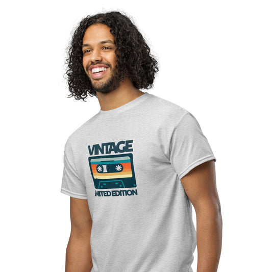 Man wearing a gray t-shirt with a vintage cassette design on a white background