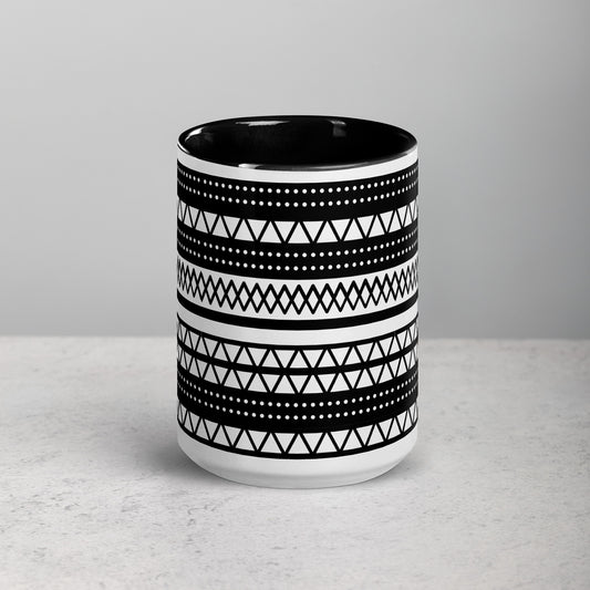 Ceramic mug with black and white geometric pattern on a gray background