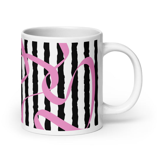 White mug with black and pink abstract design on a white background